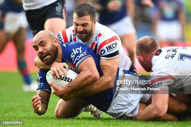 Dylan Walker of the Warriors is tackled by James Tedesco of the Roosters during the round nine NRL match between New Zealand Warriors and Sydney...