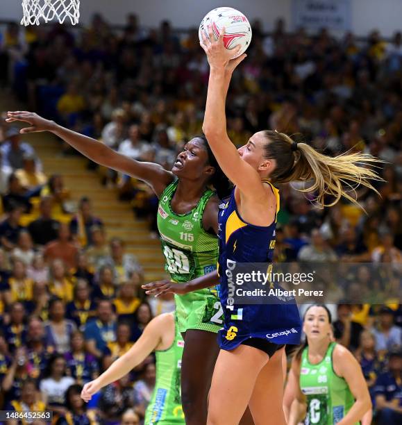 Cara Koenen of the Lightning wins the ball against Sunday Aryang of the Fever during the round seven Super Netball match between Sunshine Coast...