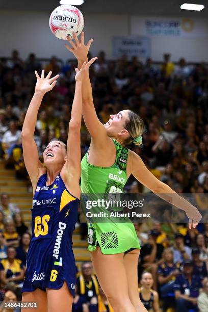 Cara Koenen of the Lightning and Courtney Bruce of the Fever compete for the ball during the round seven Super Netball match between Sunshine Coast...
