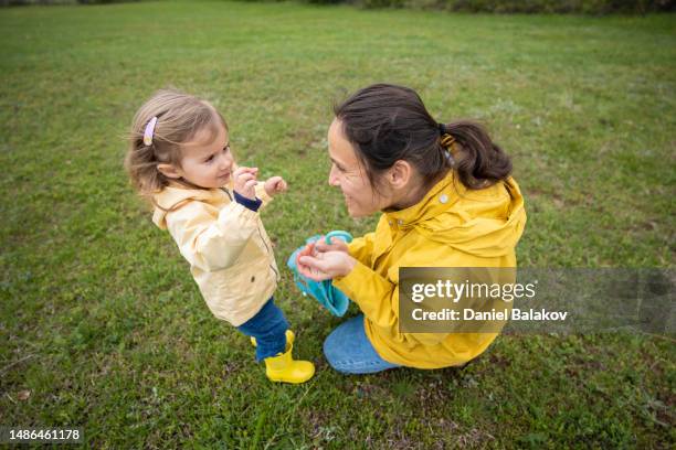 mom and kid on a spring walk in nature. - non moving activity stock pictures, royalty-free photos & images