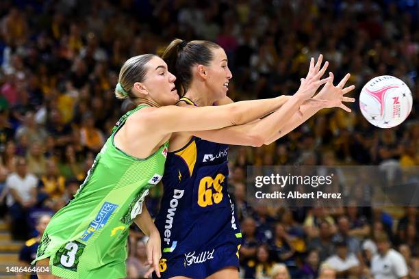 Courtney Bruce of the Fever and Cara Koenen of the Lightning compete for the ball during the round seven Super Netball match between Sunshine Coast...