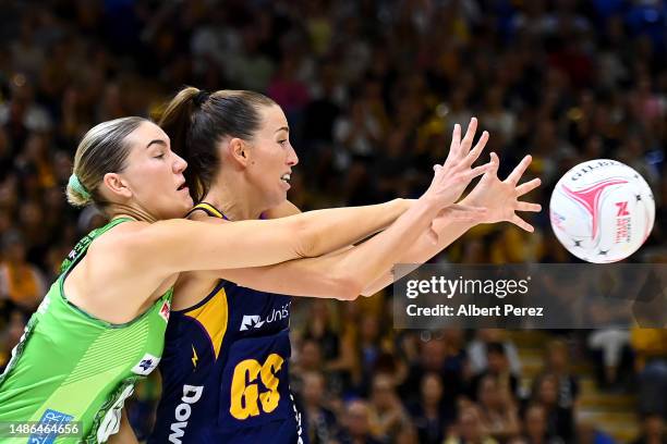 Courtney Bruce of the Fever and Cara Koenen of the Lightning compete for the ball during the round seven Super Netball match between Sunshine Coast...