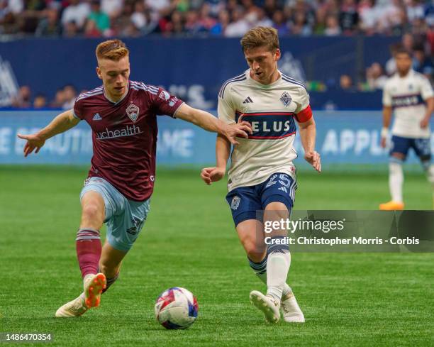 Connor Ronan 0f the Colorado Rapids goes for the ball against Ryan Gauld of the Vancouver Whitecaps FC at BC Place on April 29, 2023 in Vancouver,...