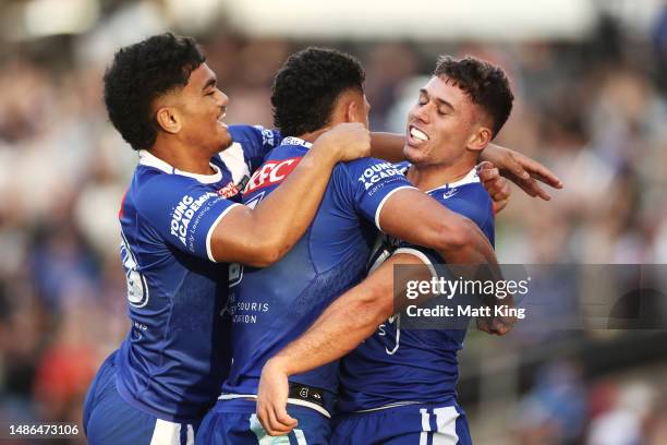 Jake Averillo of the Bulldogs celebrates with team mates after scoring a try during the round nine NRL match between St George Illawarra Dragons and...