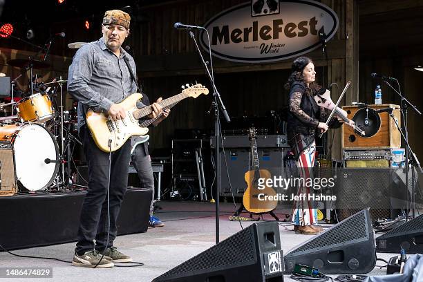 Singer/guitarist Jeb Puryear and Tara Nevins of Donna the Buffalo performs during Merlefest at Wilkes Community College on April 29, 2023 in...