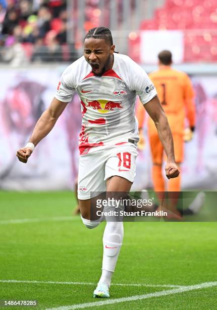 Christopher Nkunku of RB Leipzig celebrates after scoring his sides first goal during the Bundesliga match between RB Leipzig and TSG Hoffenheim at...