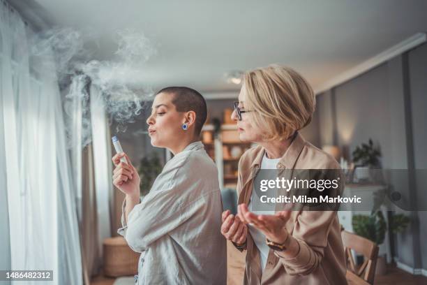 smoking is not healthy - teens vaping stock pictures, royalty-free photos & images