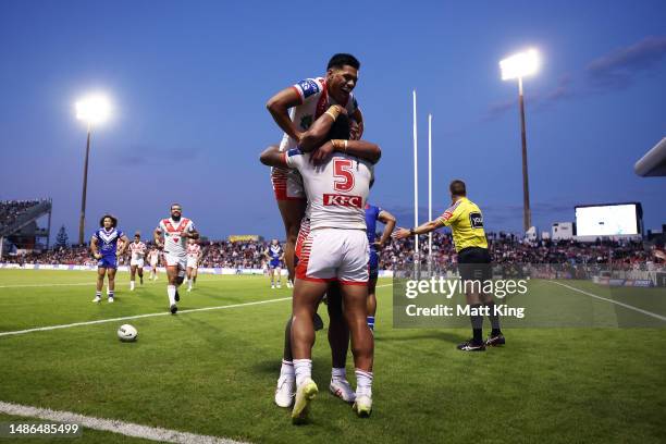 Max Feagai of the Dragons celebrates with team mates after scoring a try during the round nine NRL match between St George Illawarra Dragons and...