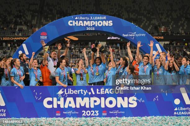 Sydney FC players celebrate the A-league trophy after winning the A-League Women's Grand Final match between Western United and Sydney FC at CommBank...