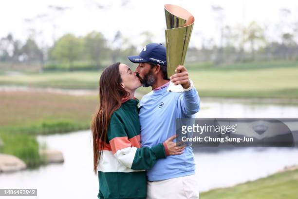 Pablo Larrazabal of Spain kisses his girlfriend Adriana Lamelas after winning the tournament on Day Four of the Korea Championship Presented by...