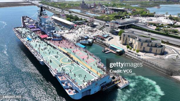 Tourists visit the Tianjin Binhai Aircraft Carrier Theme Park during the five-day May Day Holiday on April 30, 2023 in Tianjin, China.