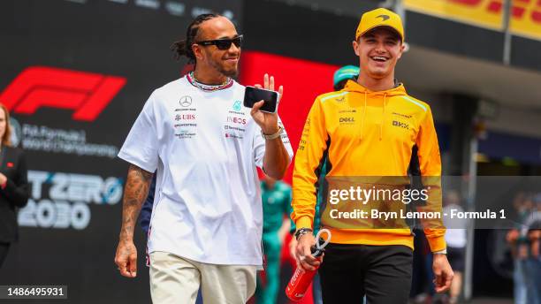 Lewis Hamilton of Great Britain and Mercedes and Lando Norris of Great Britain and McLaren talk prior to the F1 Grand Prix of Azerbaijan at Baku City...