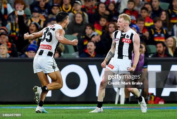 John Noble of the Magpies celebrates a goal with Nick Daicos of the Magpies during the round seven AFL match between Adelaide Crows and Collingwood...