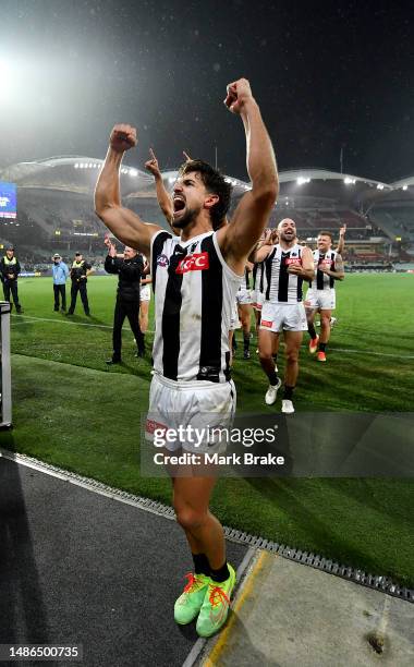 Josh Daicos of the Magpies celebrates the win as heads down the race during the round seven AFL match between Adelaide Crows and Collingwood Magpies...