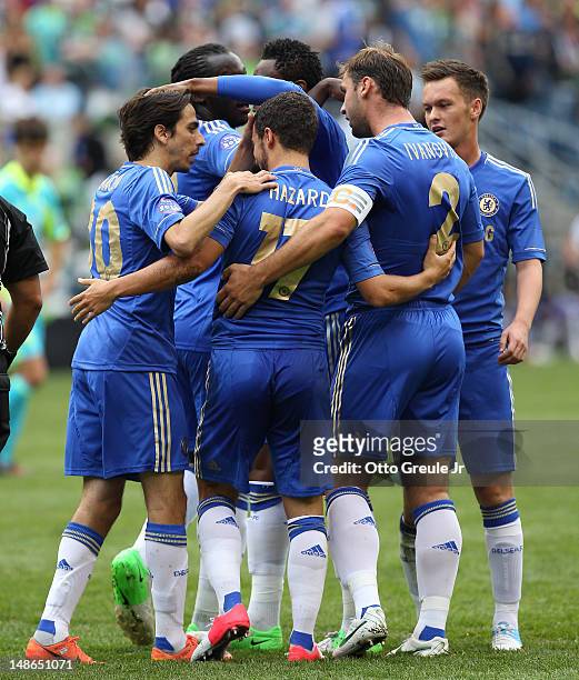 Eden Hazard of Chelsea FC is congratulated by teammates after scoring the second goal against the Seattle Sounders FC at CenturyLink Field on July...