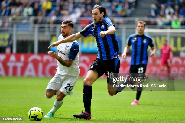 Mattia Zaccagni of SS Lazio compete for the ball with Matteo Darmian of FC Internazionale during the Serie A match between FC Internazionale and SS...