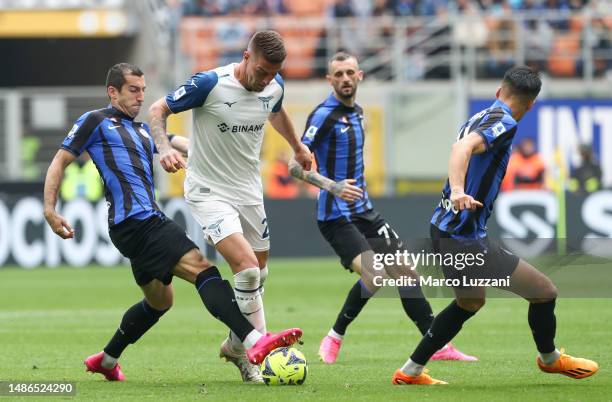 Sergej Milinkovic-Savic of SS Lazio battles for possession with Henrikh Mkhitaryan of FC Internazionale during the Serie A match between FC...