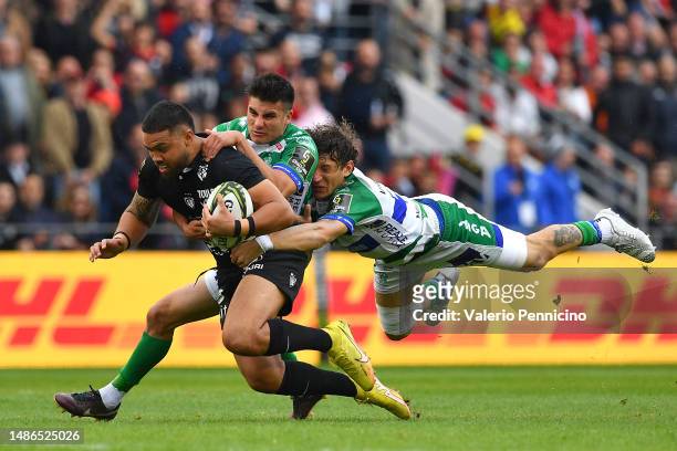 Duncan Paia'aua of RC Toulon is tackled by Matteo Minozzi and Tomas Albornoz of Benetton Rugby during the EPCR Challenge Cup Semi-Final match between...