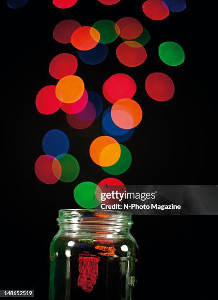 Abstract image of coloured lights streaming from an open glass jar, taken on October 12, 2011.