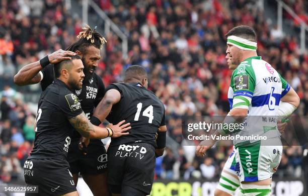 Duncan Paia'aua of RC Toulon celebrates with teammates Waisea Nayacalevu and Jiuta Naqoli Wainiqolo after scoring a try during the EPCR Challenge Cup...