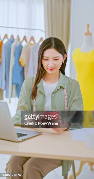 fashion designer work in studio - design studio woman chinese laptop stock pictures, royalty-free photos & images