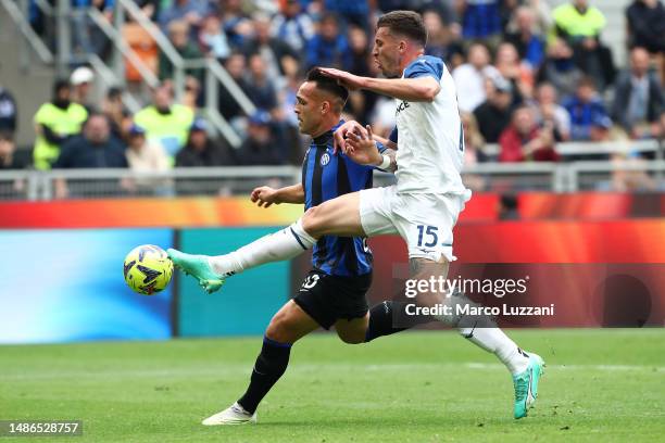 Lautaro Martinez of FC Internazionale battles for possession with Nicolo Casale of SS Lazio during the Serie A match between FC Internazionale and SS...