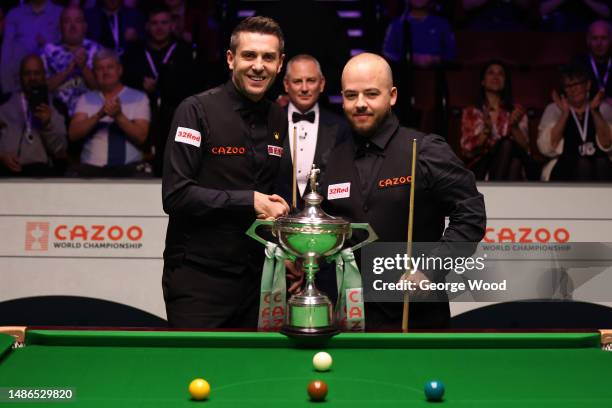 Mark Selby of England and Luca Brecel of Belgium pose for a photo prior to their Final match on Day Sixteen of the Cazoo World Snooker Championship...