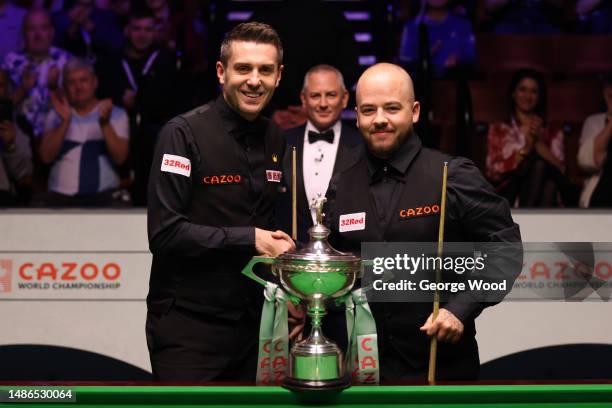 Mark Selby of England and Luca Brecel of Belgium pose for a photo prior to their Final match on Day Sixteen of the Cazoo World Snooker Championship...