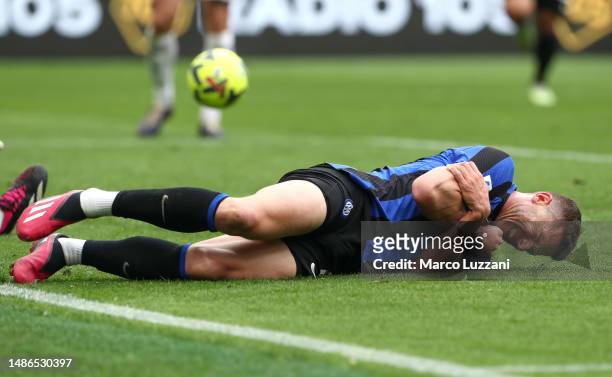 Robin Gosens of FC Internazionale goes down with an injury after scoring the team's second goal during the Serie A match between FC Internazionale...