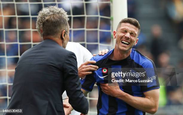 Robin Gosens of FC Internazionale receives medical treatment after scoring the team's second goal during the Serie A match between FC Internazionale...
