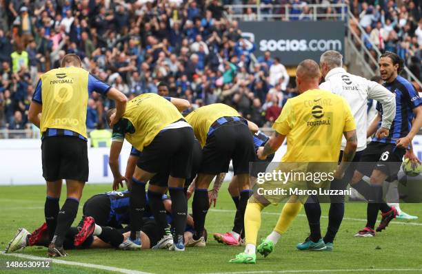 Robin Gosens of FC Internazionale goes down with an injury as teammates celebrate with him after scoring the team's second goal during the Serie A...