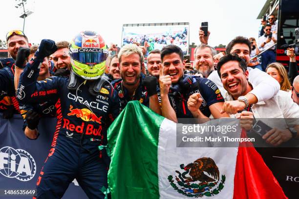 Race winner Sergio Perez of Mexico and Oracle Red Bull Racing celebrates with teammates in parc ferme during the F1 Grand Prix of Azerbaijan at Baku...