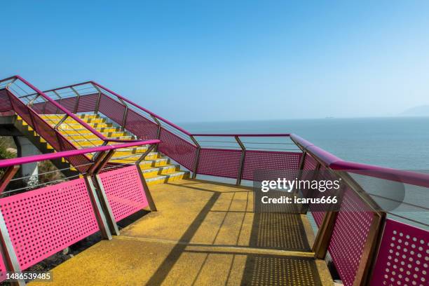 the red staircase by the seaside - fame park stock pictures, royalty-free photos & images