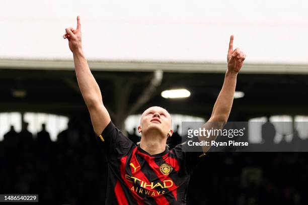 Erling Haaland of Manchester City celebrates after scoring the team's first goal from the penalty spot, their 50th goal in all competitions this...