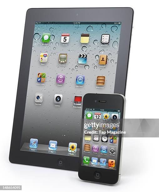 An Apple iPad and iPhone 4S smartphone, photographed during a studio shoot for Tap Magazine, November 4, 2011.