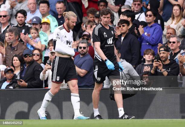 Tim Ream of Fulham walks off the pitch with an injury during the Premier League match between Fulham FC and Manchester City at Craven Cottage on...