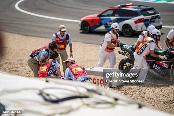 Medical staff are checking Fabio Quartararo of France and Monster Energy Yamaha MotoGP and Miguel Oliveira of Portugal and CryptoDATA RNF MotoGP Team...