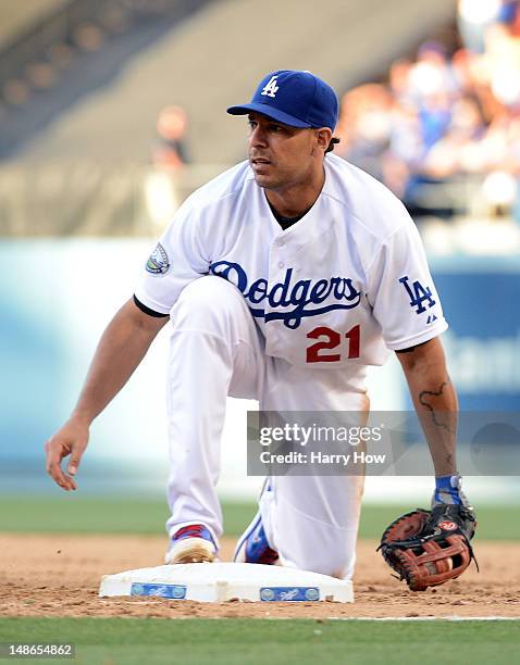 Juan Rivera of the Los Angeles Dodgers fields a groundball during the game against the New York Mets at Dodger Stadium on June 30, 2012 in Los...