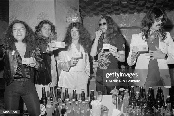 Rock group Deep Purple posed at a Warner Brothers record company press reception in Japan in December 1975. Left to right: drummer Ian Paice,...