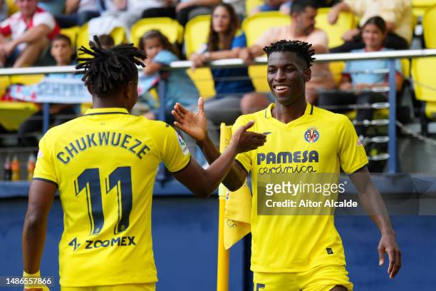 Nicolas Jackson of Villarreal CF celebrates with teammate Samuel Chukwueze after scoring the team's first goal during the LaLiga Santander match...