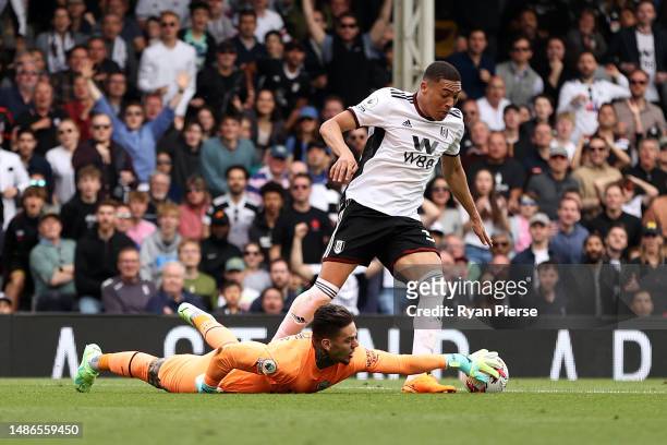 Carlos Vinicius of Fulham battles for possession with Ederson of Manchester City during the Premier League match between Fulham FC and Manchester...