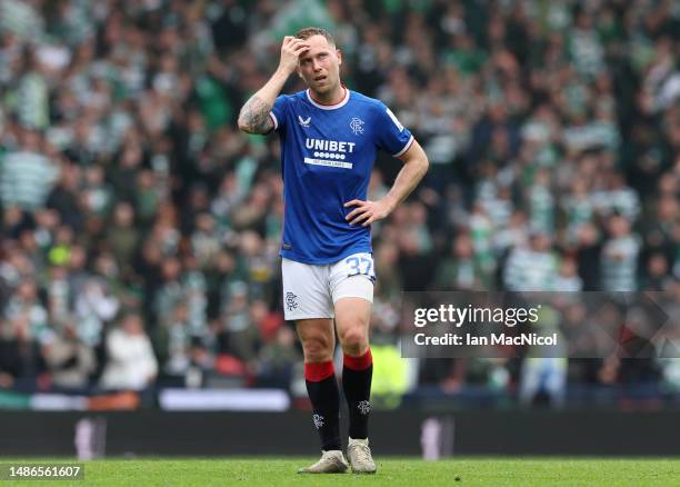 Scott Arfield of Rangers looks dejected following the team's defeat in the Scottish Cup Semi Final match between Rangers and Celtic at Hampden Park...
