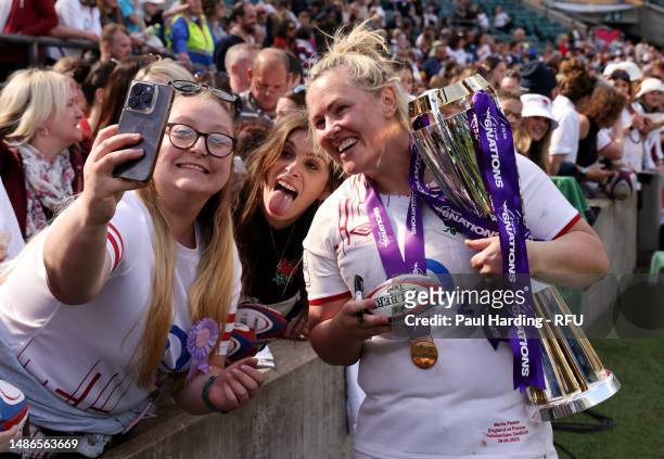 Marlie Packer of England interacts with the fans with the trophy after the TikTok Women's Six Nations match between England and France at Twickenham...