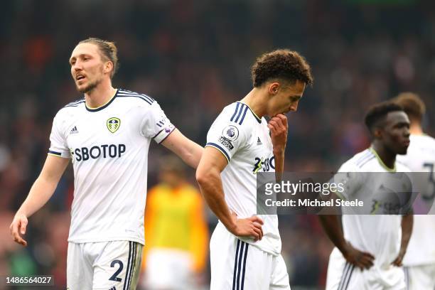 Luke Ayling and Rodrigo Moreno of Leeds United look dejected after the team's defeat in the Premier League match between AFC Bournemouth and Leeds...