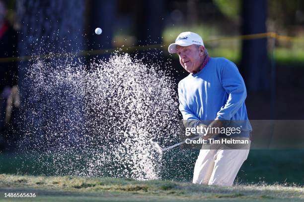 Billy Mayfair of the United States chips out of a bunker on the first hole during the final round of the Insperity Invitational at The Woodlands Golf...