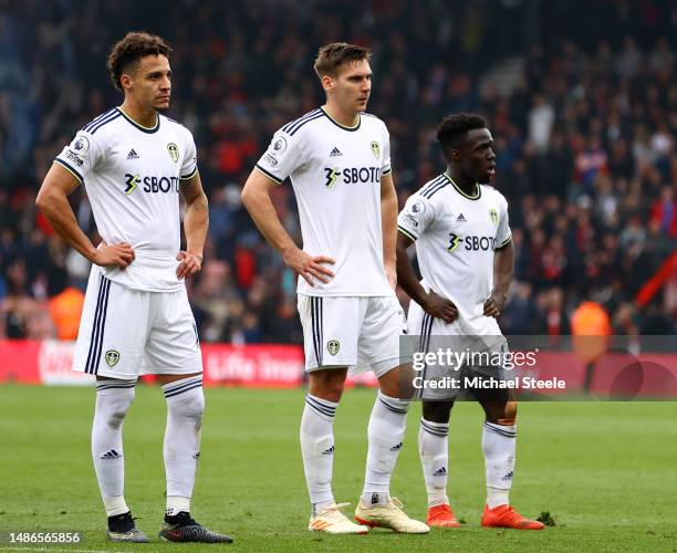 Rodrigo Moreno, Max Woeber and Wilfried Gnonto of Leeds United look dejected following the team's defeat in the Premier League match between AFC...