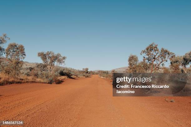 gravel red sand road, australia - australian culture stock pictures, royalty-free photos & images
