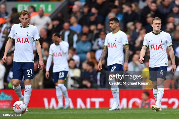 Tottenham Hotspur players look dejected after Liverpool scores two during the Premier League match between Liverpool FC and Tottenham Hotspur at...