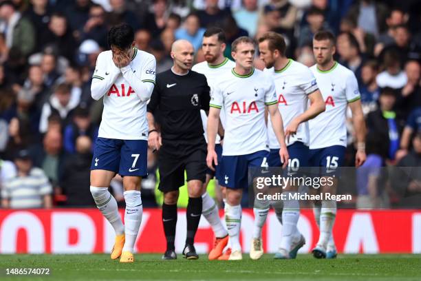 Son Heung-Min of Tottenham Hotspur and teammates look dejected after Liverpool score three during the Premier League match between Liverpool FC and...