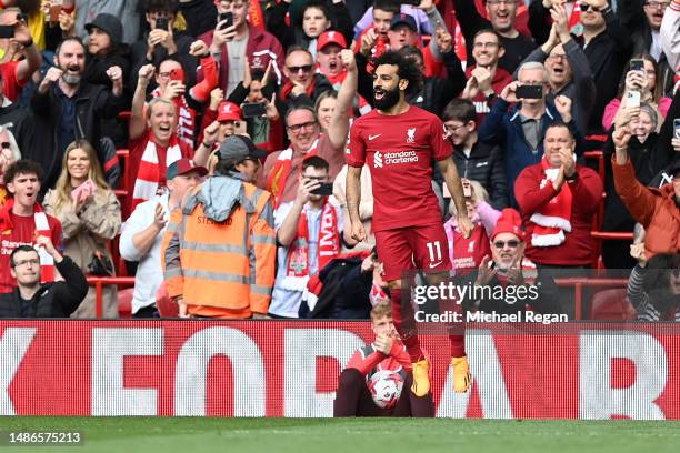 Mohamed Salah of Liverpool celebrates after scoring the team's third goal during the Premier League match between Liverpool FC and Tottenham Hotspur...